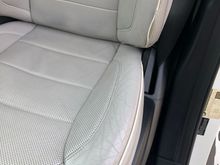 Leather wear on Driver's Seat - leather is not split or worn through. Piping, however, is slightly exposed at the very bottom.