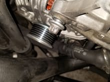 Remove the alternator upper bolt. 