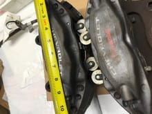 This is how the front camaro calipers and pads are. They have lead weights on the calipers and pads. Those had to go to clear. 