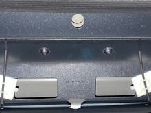 I used plastic zip tie tied down pads with adhesive and strapped them to the metal roof panel with the adhesive and white zip ties as shown. 