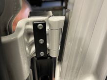 Then attach the main part of the tire holder that grabs the hinges.