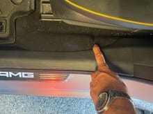 This is the spot I could use my fingers (no tools required) to pull the plastic trim up and it is easily removed pulling up and working towards the front of the car.