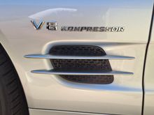 Supercharged emblem "Kompressor"