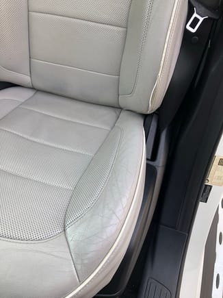 Leather wear on Driver's Seat - leather is not split or worn through. Piping, however, is slightly exposed at the very bottom.