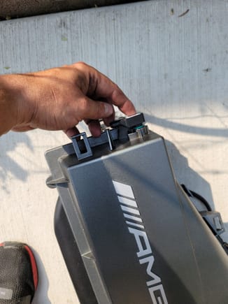 Remove the air box air sensor by unplugging the clip, rotate counter clockwise and pull out, same procedure on either side of the intake box. You will use the oem harness on the passanger side to connect to the blackboost system
