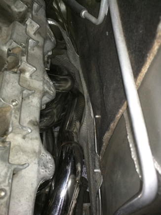 Driver side from engine bay, there is no rubbing, but it is very tight. The steering shaft should be disconnected. It is a ton easier,
