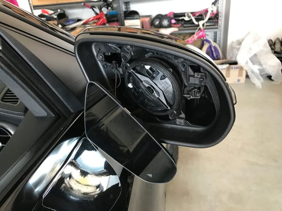 Push mirror glass back into position and reposition
