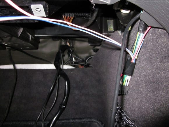 Next is CANBUS for wiring controls. This is the one under the dash, very easy to find with the lower cover off. Ignore the black wire vomit down the bottom, I am pretty sure these are aftermarket additions. ASWC-1 loom on the right and the thick black wire on the right is the USB from the headunit.