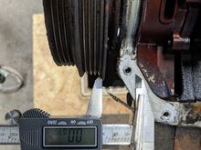 Want to measure crank end play? Don't have a magnetic base dial gauge? Sure, just tighten down the crank pulley and clamp your caliper to the oil pump. Push the crank toward the back of the engine. Zero the caliper against the pulley, then pull the crank forward. Repeat to judge accuracy. Looks good to me.