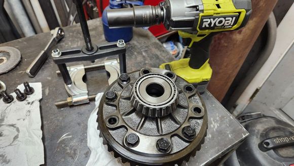 Harmonic balancer bolt socket and impact. Thankfully the bolts were centered in the holes and the threads didn't get damaged during removal.