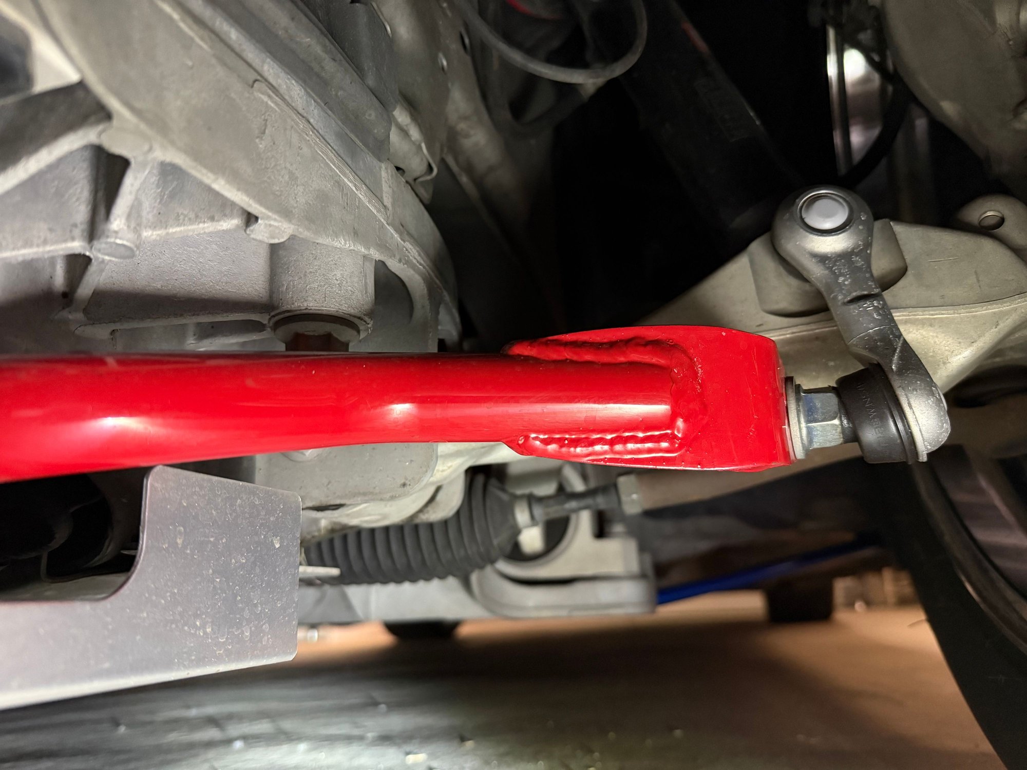 Driver’s side.  Jew from in front of the wheel.