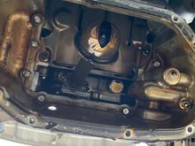 Bottom of the picture is front of car. Those bottom two bolts hold the timing chain in. Gotta take them bad boys out 