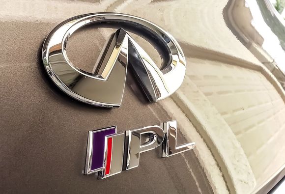 When I decided to put non-black emblems on the car I opted for just the Infiniti logo and IPL badge - centered on the back.