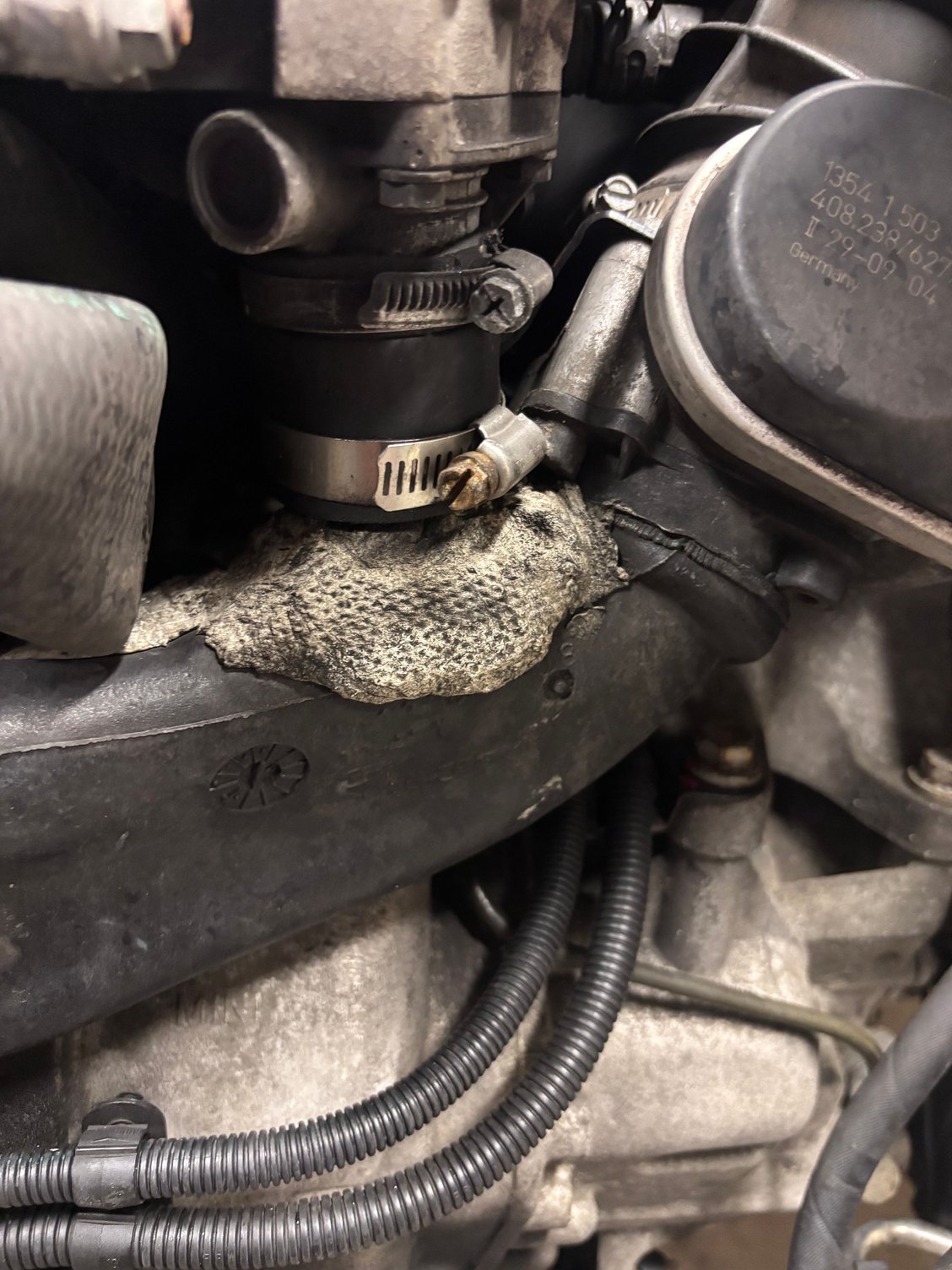 What did I say? I knew something was off and I called it once I got my car back from the guys that did my clutch! Seems like they broke the black snout off the inlet tube and used this weird cement foam glue to put it back in place. It worked but I am def not happy about it and will soon be replacing it. 