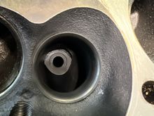 Quarter sized flat surface facing incoming exhaust flow in exhaust runner.