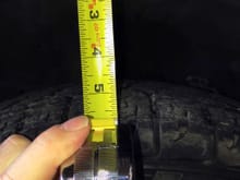 Front left height measurement from the top of the tire to the wheel well peak.