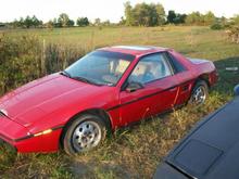 86 4 cyl fiero. got this one from Oklahoma city, drove it back from there to Nashville on snowy roads with 1 brake grabbing, 2 bald front tires and a rigged up left lower control arm on 2&quot; of Ice most of the way. got great gas mileage though, right at 34 mpg