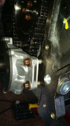 Installing oil pump with spacers to clear the double chain