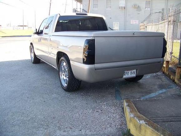 OEM Tail Lights And 3rd Brake Light Smoked - Sir Michael's Steel Roll Pan Welded And Molded - Precision Flip-up Licence Plate - Sir Michael's Roll Pan Hitch Class III - Fabtech Bed Angled Spare Tire Mount - Tailgate Handle and Top Cap Shaved
