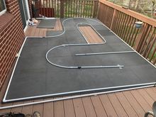 Under $100 Covid track! Harbor freight tiles and PVC. I can’t recommend doing this outdoors, royal PIA to maintain!