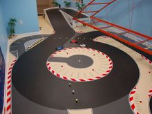 The carousel turn. The pegs here are setup for the switchbacks route which doesn't use the carousel but its a nice picture of it. The left side has a 28in lane width and the right side is 22in lane width. The entire outside area of the track is 28in wide lane width, the entire infield is 22in wide lane width.