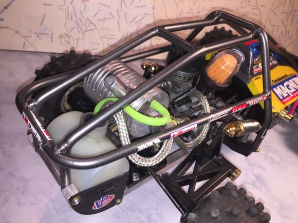 Found some braided fuel line... kinda cool. Refinished the roll cage in metallic gun metal auto paint