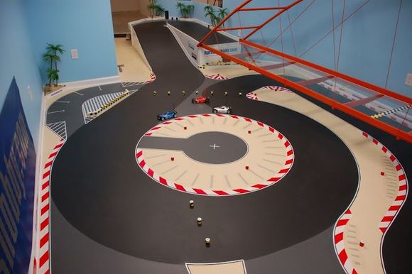 The carousel turn. The pegs here are setup for the switchbacks route which doesn't use the carousel but its a nice picture of it. The left side has a 28in lane width and the right side is 22in lane width. The entire outside area of the track is 28in wide lane width, the entire infield is 22in wide lane width.