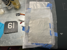 4 layers of glass, epoxied, on top of my foil and wax paper "release agent."