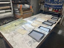 A table full of materials and molds for the flaps and rudder