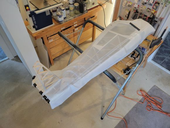 The fuselage will be covered as its full scale counterpart would have been in two sections.  The full scale version would have its horizontal stabilizer removed, making the job easier.  I will have to work around it.