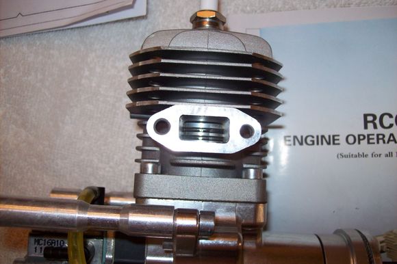 EXHAUST PORT AND PISTON RINGS