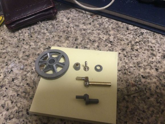 Idler wheel and idler axle cleaned up and ready to fit.