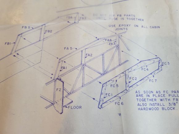 Close up detail of the cabin fuselage side detail.  As you can see the middle FA pieces are sandwiched between the inner FB pieces and the outer FC pieces.  Once glued together, this will give the needed strength and support for the wing attached above it.