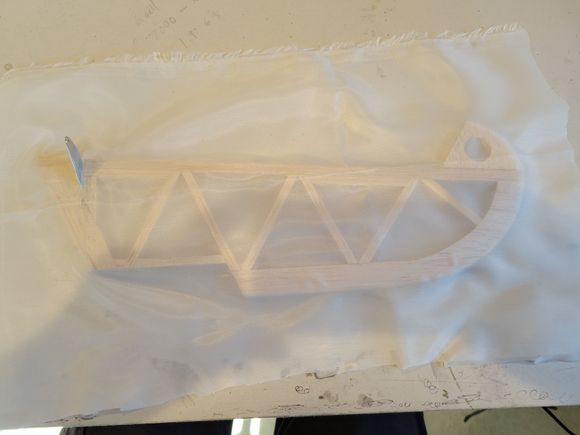 Stix-It was applied around the perimeter of the elevator, once dried the fabric was laid over the top of the elevator and ironed down with low heat.