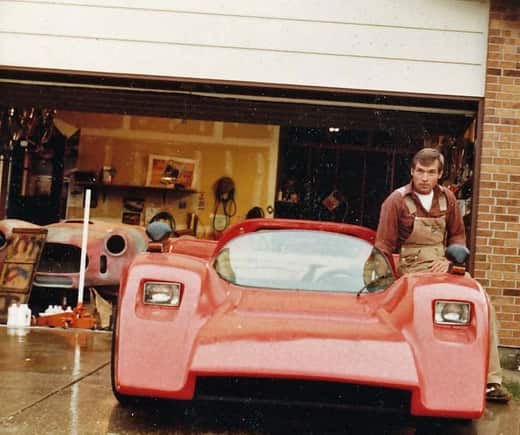 Ed sitting on the McClaren and an unfinished Cobra in the background. At his house in Aurora, Colo.