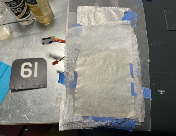 4 layers of glass, epoxied, on top of my foil and wax paper "release agent."