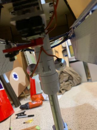 Photo from rear of upper nose strut. I zip tied the 2 landing light wires to rear of strut 