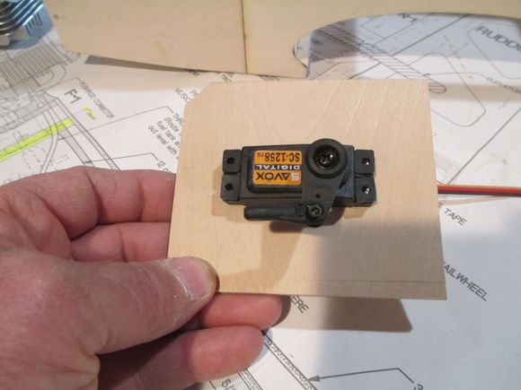 After deciding on where to place the throttle servo, I made a mounting plate from 1/8" birch plywood.  