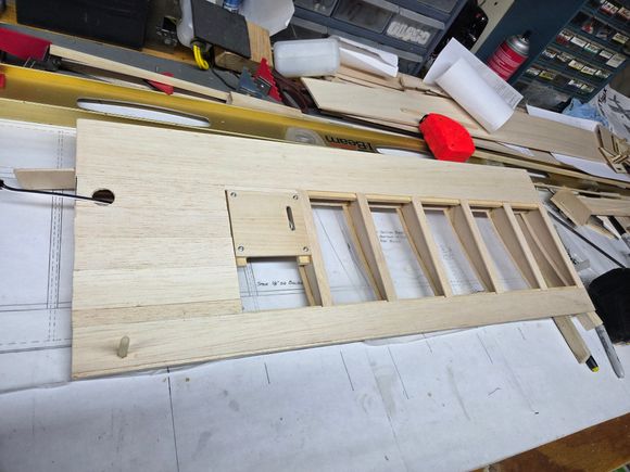 When I remove the servo for covering I'll pull a string through the holes to pull the wires back out.