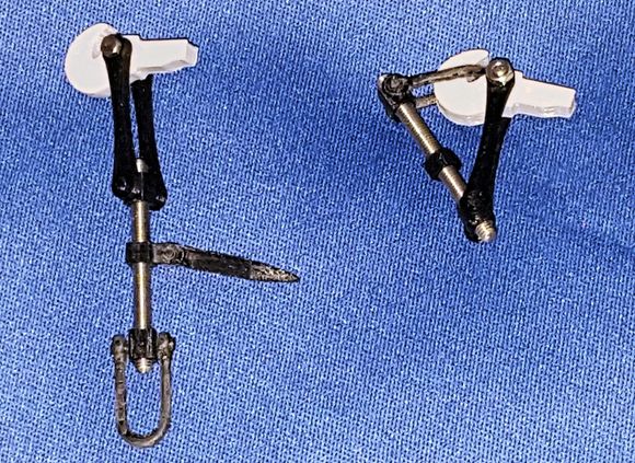 Prototypical Couplers left one has handle to tighten coupler