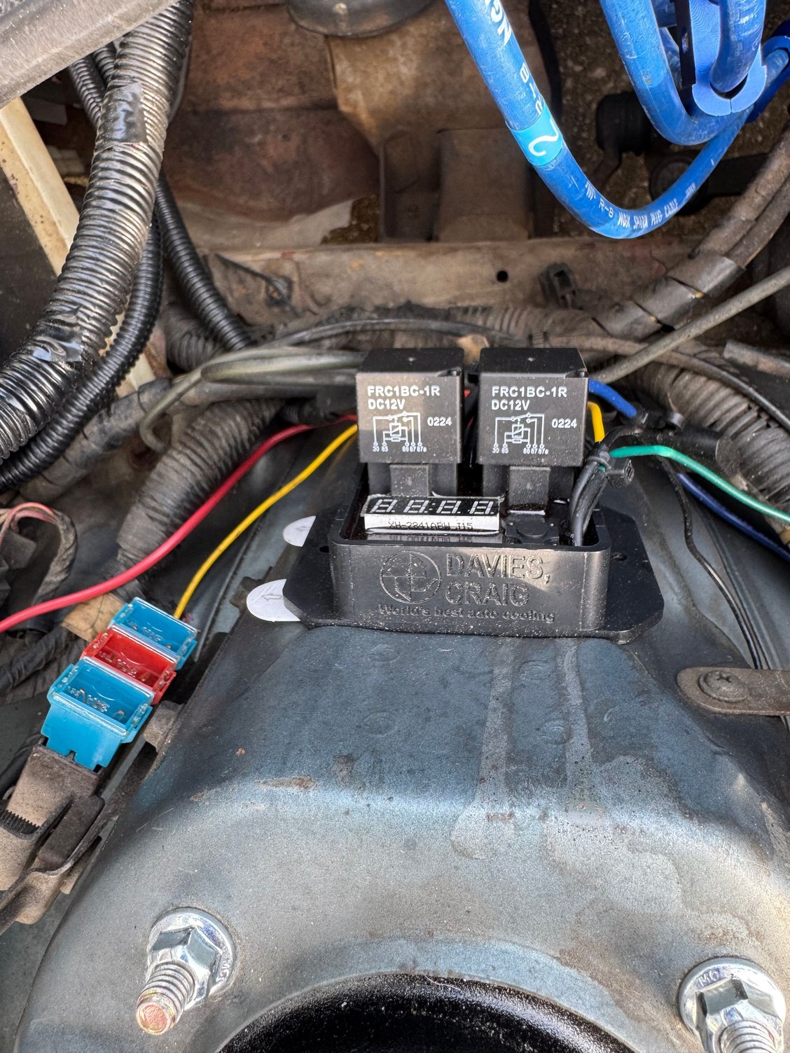 I opted for an easy electronics solution, Davies Craig Digital Thermo Switch. Mounted it to the drivers side strut tower with some heavy duty Command Strips for now. 