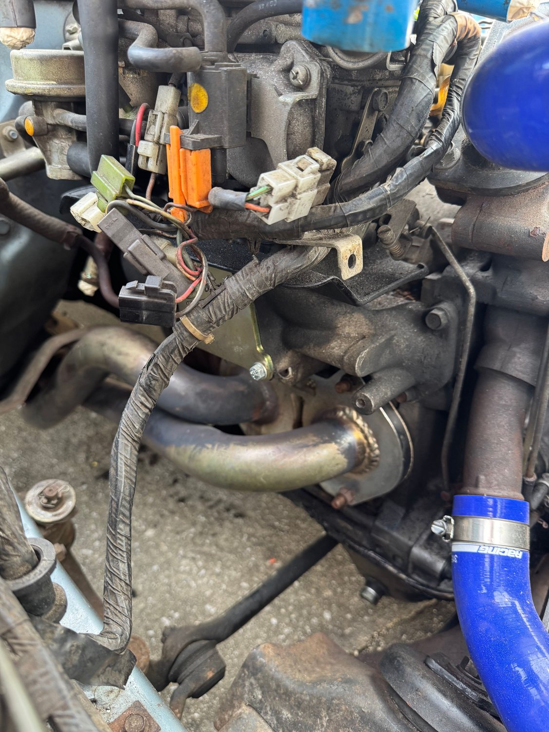 Racing Beat Street Port Header and ACV block off plate.