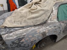 You can make out the original welds coming up from the wheel well and across the B-pillar