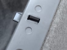 the hole that needs the correct screw to match the others.