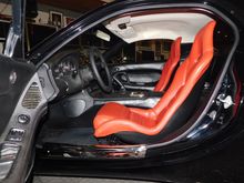 If you look carefully, you can see the part of the seat that is covered in black leather and how it blends with the rest of the interior.  You can also see the headliner.  