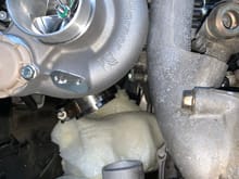 I was relieved once I got the secondary turbo here, enough room for a downpipe from the primary turbo to pass to the left.  You can also see the cut reducer in this picture, a small 45 or 60 degree 2" pipe will go between the reducer and the vband flange on the turbo.