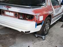 Rear bumper with some black tape where the crack is. 