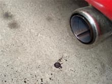 water and oil mix dripping out of the tailpipe