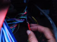 So the red wire on the black box was originally connected to this black wire that im trying to connect to show you.