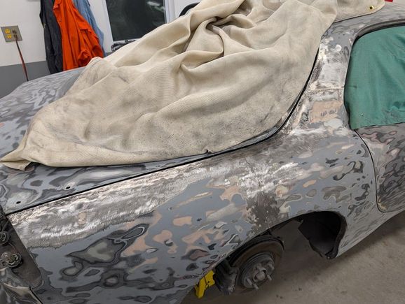 You can make out the original welds coming up from the wheel well and across the B-pillar